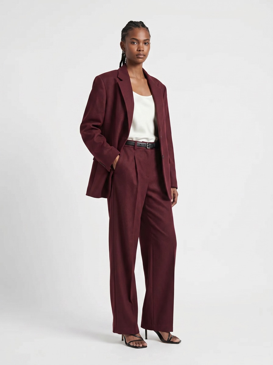 AI e-commerce product shot of the burgundy suit on a model, neutral studio background