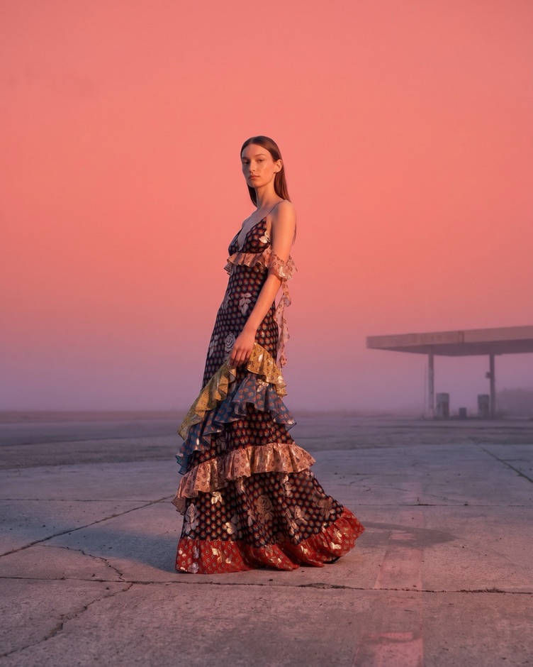 AI fashion campaign, same model in a patterned dress, closing shot