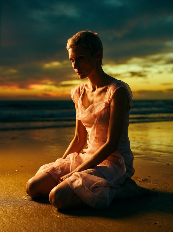AI fashion model at golden hour by the sea