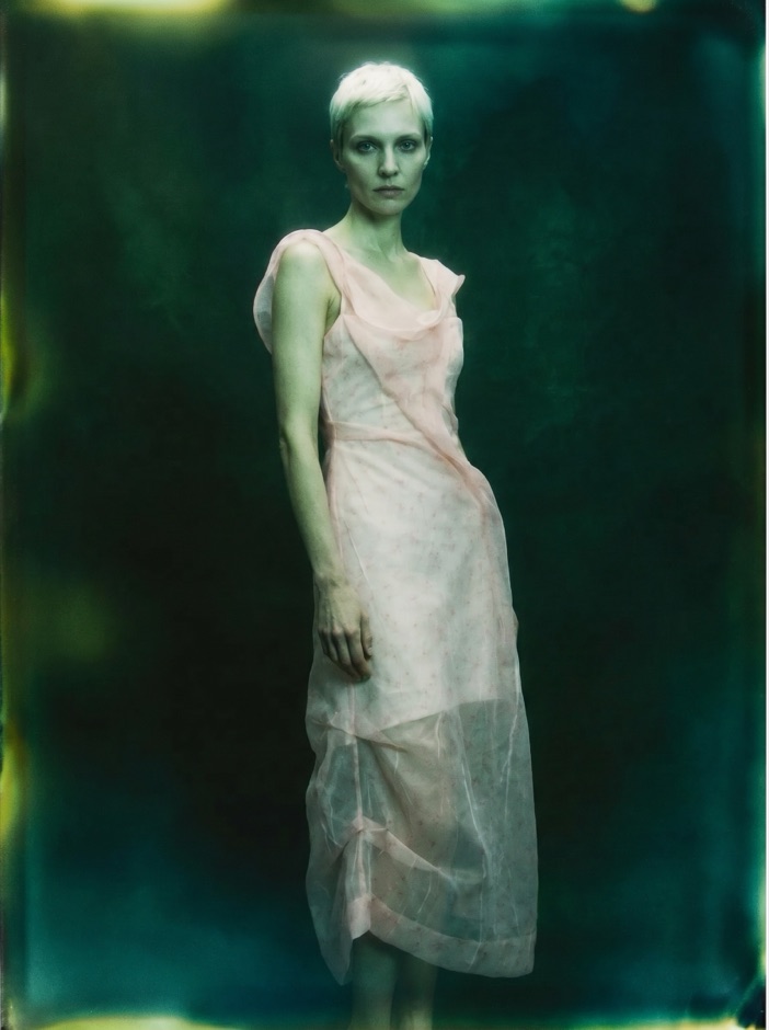 Ethereal AI fashion shot, model in a pale white dress